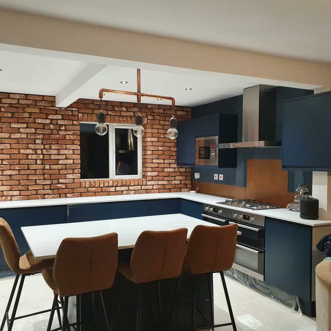 Antiqued copper backsplash in kitchen