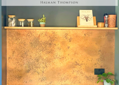 burnished copper backsplash in kitchen by Halman Thompson