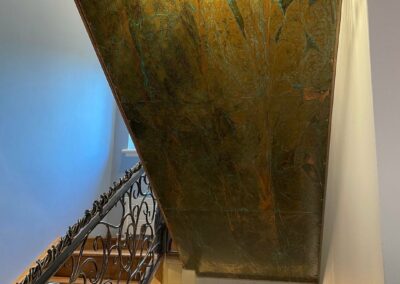 Aged Copper Panels Under Staircase