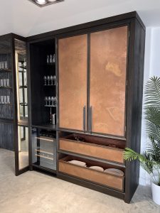 burnished copper sheet used as cupboard doors in classic kitchen design