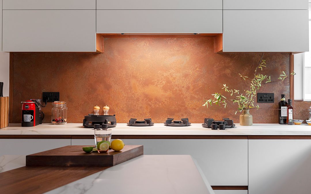 copper splashback with cutouts for plug sockets