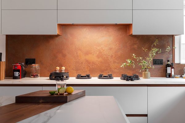 copper splashback with cutouts for plug sockets