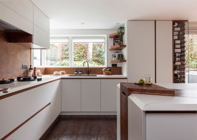 copper and exposed wood in modern white kitchen