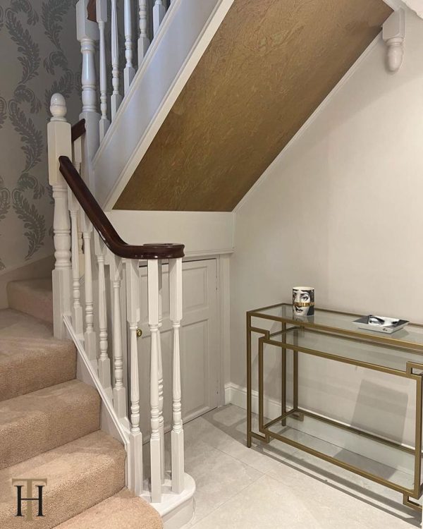 aged brass staircase decoration using a somerset finish from Halman Thompson