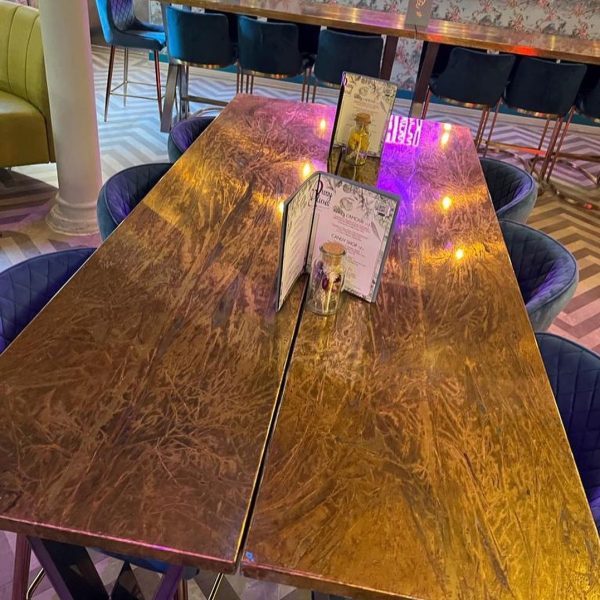 beautiful Somerset finish brass table top in gloss for a restaurant bar