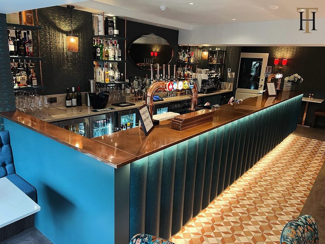 Custom-made aged copper bar top inside the bar room of Dewars Hotel in Malton, North Yorkshire