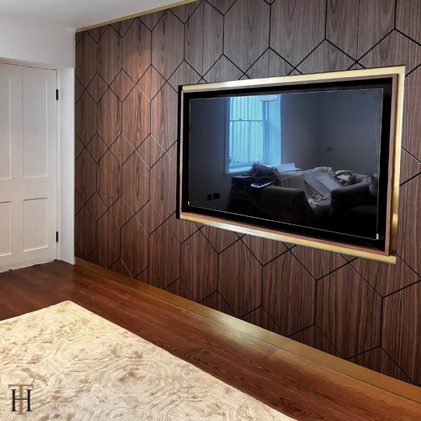 entertainment wall with brushed brass finishes