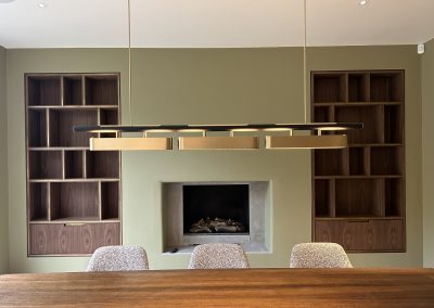 aged brass cabinet inlays in modern dining room with brass lighting
