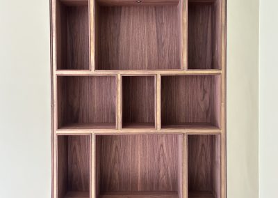 wood shelving with brass accents